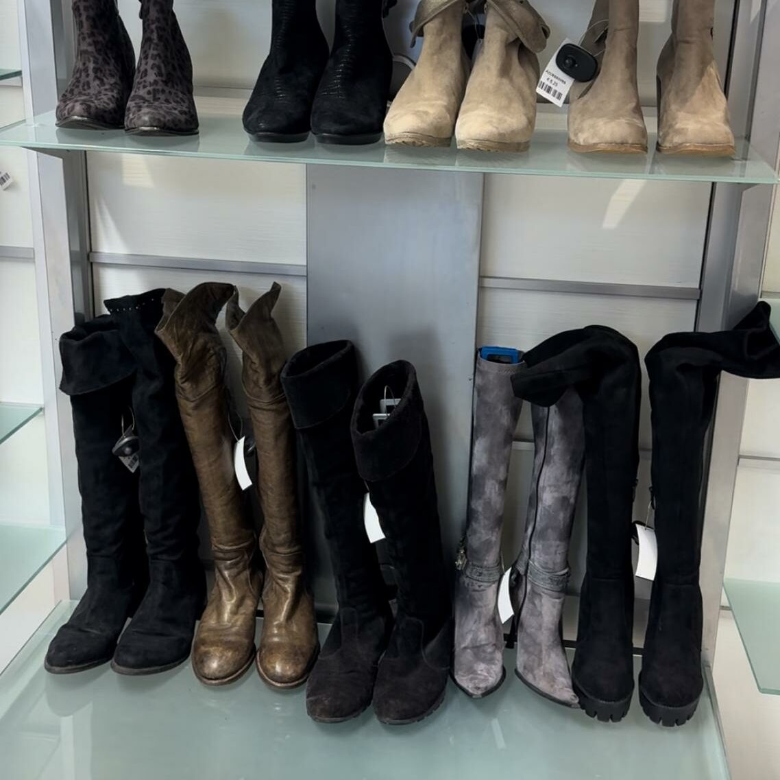 Shelf with high-knee boots. 