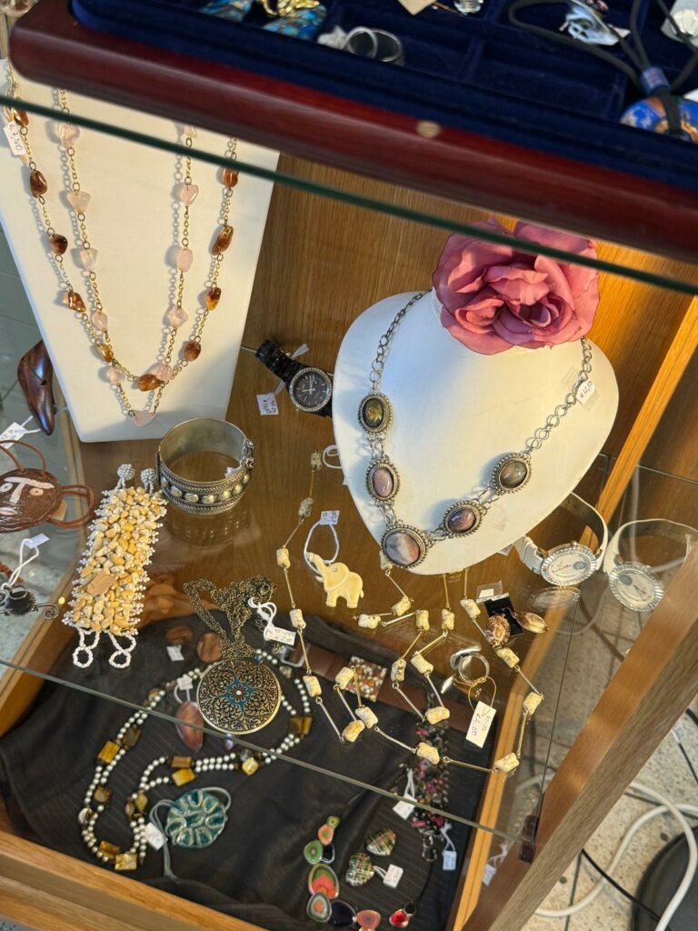 Jewellery on a glass shelf. 