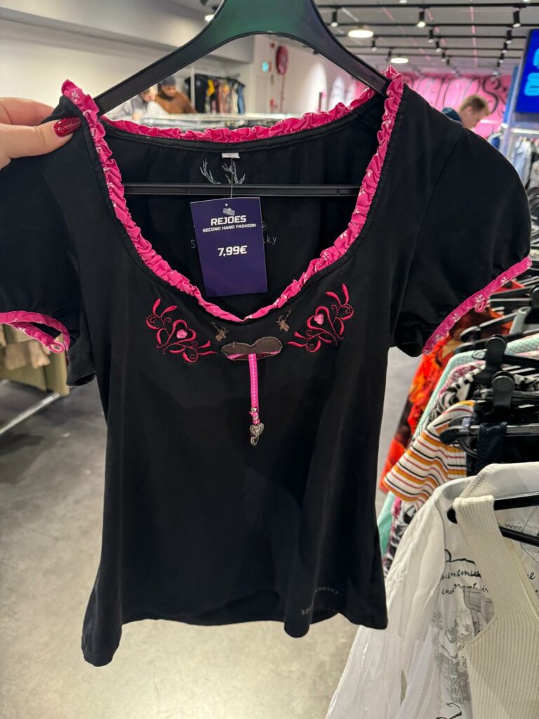 A black shirt with pink accents. 